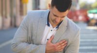 What causes breast pain in men