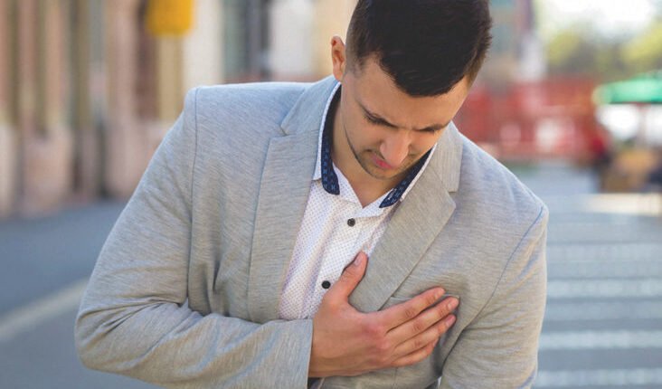What causes breast pain in men